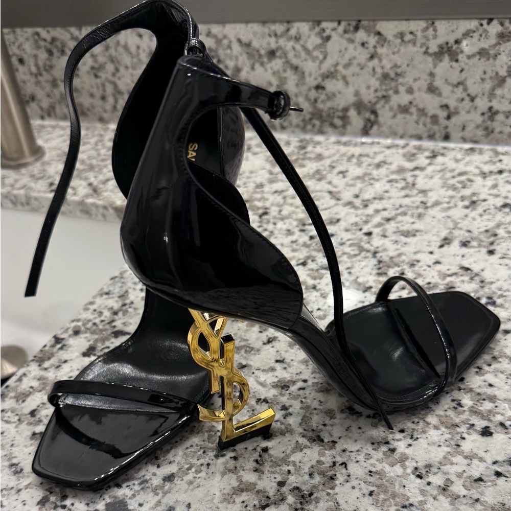 Yves Saint Laurent Black Heels with Gold Logo Accent